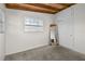 Bedroom featuring carpeted floors, exposed beam ceiling and built in storage at 6415 13Th N Ave, St Petersburg, FL 33710