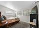 Cozy bedroom with carpet, a large TV, and two windows with bright natural light at 6415 13Th N Ave, St Petersburg, FL 33710
