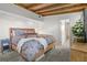 Stylized bedroom displaying detailed ceiling work, soft lighting, and an attached bathroom at 6415 13Th N Ave, St Petersburg, FL 33710