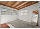 This is a cozy bedroom featuring light gray carpet, exposed beam ceiling and ample natural light at 6415 13Th N Ave, St Petersburg, FL 33710