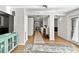 Hallway offers views of the laundry, kitchen, and living areas with hardwood floors at 6415 13Th N Ave, St Petersburg, FL 33710