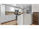 Well-lit kitchen featuring modern appliances and mosaic backsplash at 6415 13Th N Ave, St Petersburg, FL 33710