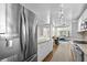 Modern kitchen with stainless steel appliances and a view of the living area at 6415 13Th N Ave, St Petersburg, FL 33710