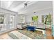 Inviting living room featuring a plush gray sectional and bright, patterned rug at 6415 13Th N Ave, St Petersburg, FL 33710