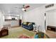 Open concept living area featuring hardwood floors and views into the adjacent, updated kitchen at 6415 13Th N Ave, St Petersburg, FL 33710