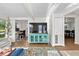 Bright living room showcasing a console, hardwood floors, and an open layout at 6415 13Th N Ave, St Petersburg, FL 33710
