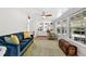 Bright living room featuring hardwood floors, built-in shelving, and an abundance of natural light at 6415 13Th N Ave, St Petersburg, FL 33710