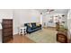 Spacious living room with hardwood floors, built-in shelving, and neutral paint tones at 6415 13Th N Ave, St Petersburg, FL 33710