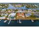 Aerial view showcasing a waterfront community with boat docks, beautiful landscaping, and stunning water views at 6442 Lake Sunrise Dr, Apollo Beach, FL 33572