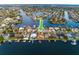 Aerial view showcasing a waterfront community with canal access and stunning residential properties at 6442 Lake Sunrise Dr, Apollo Beach, FL 33572