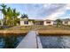 Waterfront property featuring a private dock with direct ocean access, perfect for boating enthusiasts at 6442 Lake Sunrise Dr, Apollo Beach, FL 33572