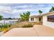 Backyard featuring waterfront access at 6442 Lake Sunrise Dr, Apollo Beach, FL 33572