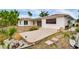 Backyard with concrete patio and water view at 6442 Lake Sunrise Dr, Apollo Beach, FL 33572