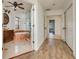 Elegant bathroom featuring a marble-trimmed tub and glass shower with wood-look flooring at 6442 Lake Sunrise Dr, Apollo Beach, FL 33572