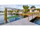View of boat dock and lift at waterfront home at 6442 Lake Sunrise Dr, Apollo Beach, FL 33572