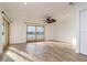 Bright living area with wood-look flooring and water views at 6442 Lake Sunrise Dr, Apollo Beach, FL 33572