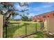 Scenic view of backyard, pond, and fence of the property on a sunny day at 6842 Dartmouth Hill St, Riverview, FL 33578