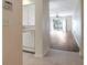 Open concept living area featuring wood flooring, a view to the backyard, and seamless flow from the kitchen at 6842 Dartmouth Hill St, Riverview, FL 33578