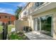 A ground floor patio with sliding glass doors overlooking the backyard and green space at 6842 Dartmouth Hill St, Riverview, FL 33578