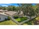 An inviting fenced backyard provides privacy and space for outdoor enjoyment, complete with a covered patio at 7031 Kendall Heath Way, Land O Lakes, FL 34637