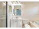 The bathroom features a tub and shower combination, a white toilet, and a vanity sink at 7031 Kendall Heath Way, Land O Lakes, FL 34637