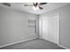 Bright bedroom featuring a ceiling fan, closet and a window providing natural light at 7031 Kendall Heath Way, Land O Lakes, FL 34637