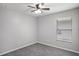 Neat bedroom featuring a ceiling fan, closet and a window at 7031 Kendall Heath Way, Land O Lakes, FL 34637