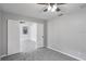 Comfortable bedroom offering neutral colors and a ceiling fan, open to the living area at 7031 Kendall Heath Way, Land O Lakes, FL 34637