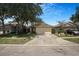 Charming single Gathering home with a well-maintained lawn and inviting curb appeal at 7031 Kendall Heath Way, Land O Lakes, FL 34637