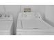 A laundry room with a white washing machine and dryer at 7031 Kendall Heath Way, Land O Lakes, FL 34637