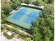 Aerial view of well-maintained community tennis courts surrounded by lush greenery at 7031 Kendall Heath Way, Land O Lakes, FL 34637