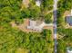 Aerial shot of a home featuring a long driveway and surrounded by lush trees, offering privacy at 7340 West Dr, Wesley Chapel, FL 33544