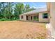 Expansive backyard with ample space for outdoor activities, featuring a covered patio for relaxation at 7340 West Dr, Wesley Chapel, FL 33544