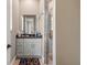 Bright bathroom featuring a modern vanity, glass-enclosed shower, and neutral tones at 7340 West Dr, Wesley Chapel, FL 33544