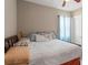 Bedroom with a brass bed, patterned curtains, and cozy decorative pillows at 7340 West Dr, Wesley Chapel, FL 33544