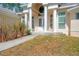 Elegant entryway with double doors and decorative glass plus bright white pillars at 7340 West Dr, Wesley Chapel, FL 33544