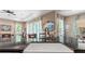 Kitchen island features a deep sink, granite countertops, and stylish fixtures, ideal for food preparation at 7340 West Dr, Wesley Chapel, FL 33544