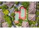 Aerial view of tennis courts surrounded by lush greenery and residential buildings at 736 Coral Reef Dr, Tampa, FL 33602