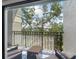 Relaxing balcony with comfortable seating and views of the surrounding lush landscape at 736 Coral Reef Dr, Tampa, FL 33602