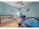 Cheerful bedroom with playful decor, light floors, and ample natural light at 736 Coral Reef Dr, Tampa, FL 33602