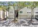Inviting townhome featuring a two-car garage, well-manicured landscaping, and a charming facade at 736 Coral Reef Dr, Tampa, FL 33602