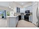 Modern kitchen with stainless steel appliances, light countertops, and contemporary light blue cabinetry at 736 Coral Reef Dr, Tampa, FL 33602
