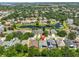 Aerial view of a residential area with a tranquil pond, highlighting the community's setting marked with a pin at 7657 Nottinghill Sky Dr, Apollo Beach, FL 33572