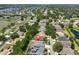 An aerial view of a charming neighborhood with tranquil lake views, showcasing the property's desirable location with a pin at 7657 Nottinghill Sky Dr, Apollo Beach, FL 33572