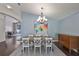 Dining room featuring hardwood floors, chandelier and an open floor plan at 7657 Nottinghill Sky Dr, Apollo Beach, FL 33572