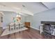 Comfortable dining area featuring hardwood floors, chandelier and an open floor plan at 7657 Nottinghill Sky Dr, Apollo Beach, FL 33572