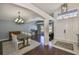 Inviting entryway showcases dining area, hardwood floors, an open floor plan and lots of natural light at 7657 Nottinghill Sky Dr, Apollo Beach, FL 33572