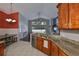 Open kitchen overlooking the living room and backyard at 7657 Nottinghill Sky Dr, Apollo Beach, FL 33572