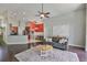Open concept living area featuring a cozy living room adjacent to the kitchen at 7657 Nottinghill Sky Dr, Apollo Beach, FL 33572