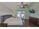 Main bedroom boasts vaulted ceilings, stylish wallpaper, and large windows with plenty of natural light at 7657 Nottinghill Sky Dr, Apollo Beach, FL 33572
